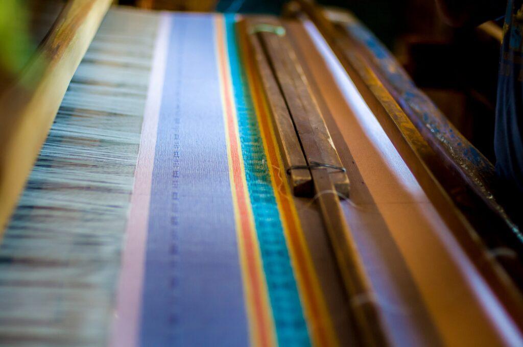 Close-up of traditional Zapotec weaving loom in Teotitlán del Valle, private artisan workshop in Oaxaca.
